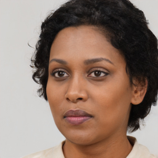 Neutral black young-adult female with medium  black hair and brown eyes