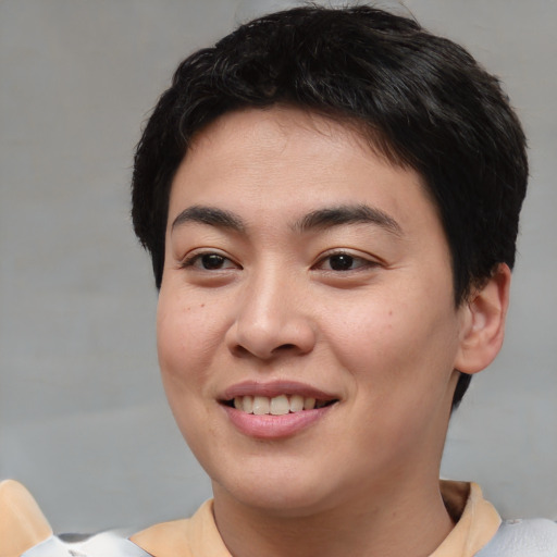 Joyful asian young-adult female with short  brown hair and brown eyes
