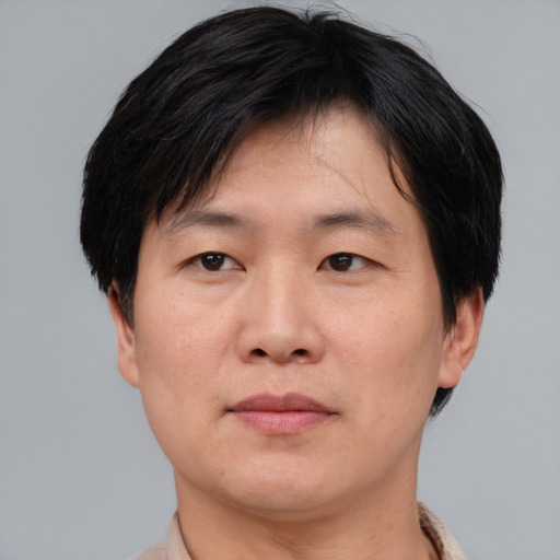 Neutral asian adult male with short  brown hair and brown eyes