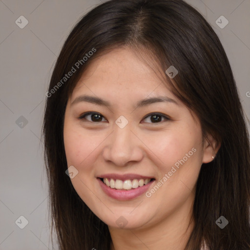 Joyful white young-adult female with long  brown hair and brown eyes