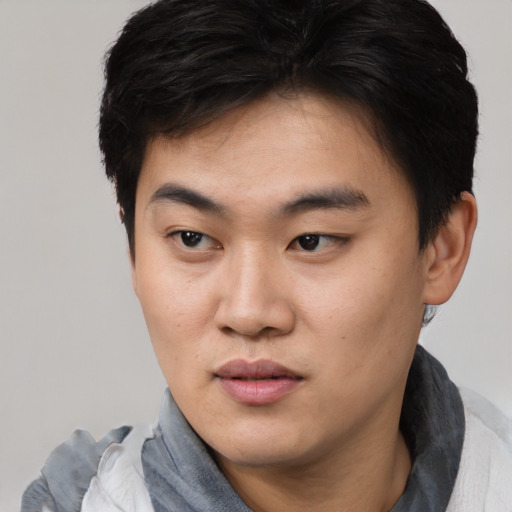 Neutral asian young-adult male with short  black hair and brown eyes