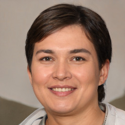 Joyful white young-adult female with medium  brown hair and brown eyes