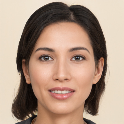 Joyful white young-adult female with medium  brown hair and brown eyes