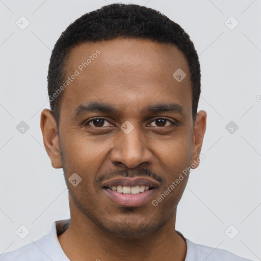 Joyful black young-adult male with short  black hair and brown eyes