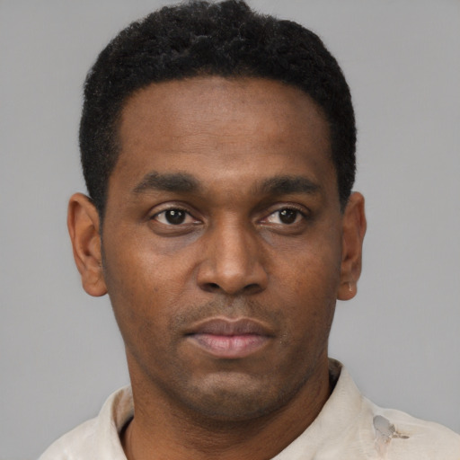 Neutral black young-adult male with short  black hair and brown eyes
