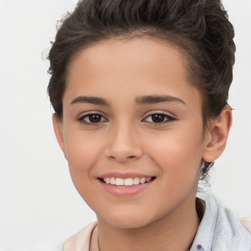 Joyful white child female with short  brown hair and brown eyes