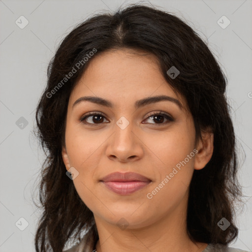 Joyful latino young-adult female with long  brown hair and brown eyes