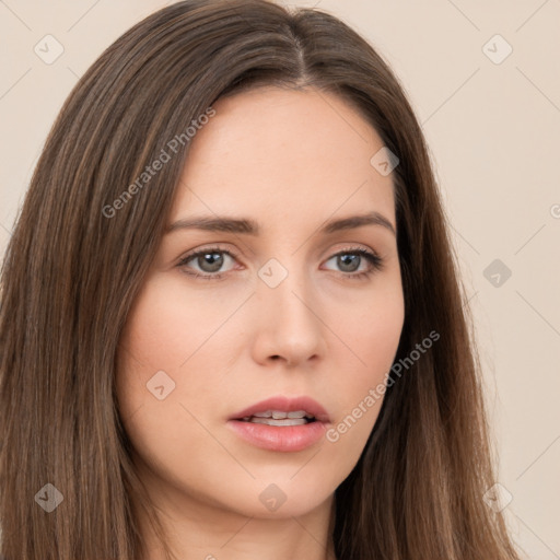 Neutral white young-adult female with long  brown hair and brown eyes