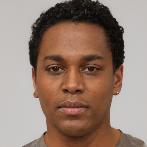 Neutral black young-adult male with short  brown hair and brown eyes
