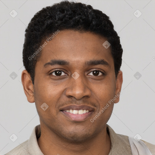 Joyful black young-adult male with short  brown hair and brown eyes