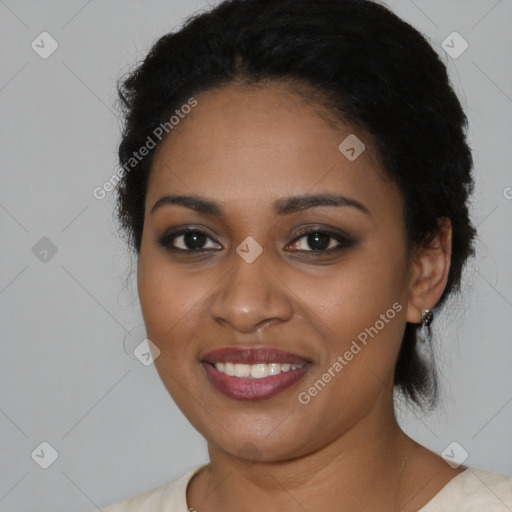 Joyful black young-adult female with medium  black hair and brown eyes