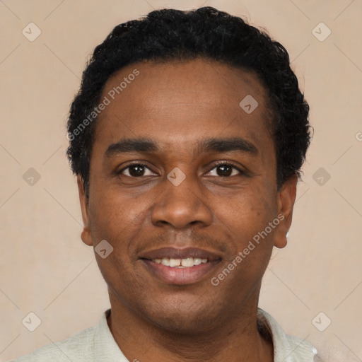 Joyful black young-adult male with short  black hair and brown eyes