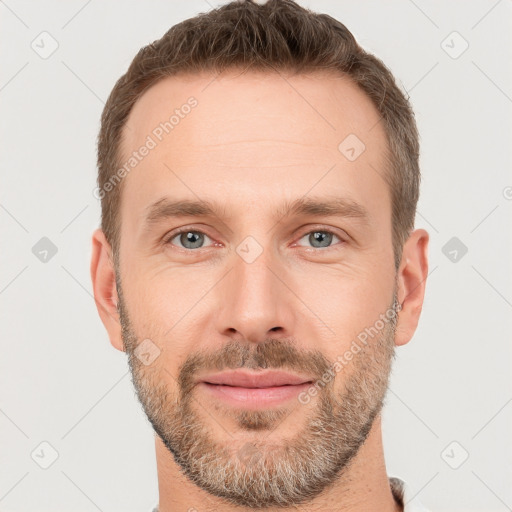 Joyful white young-adult male with short  brown hair and brown eyes