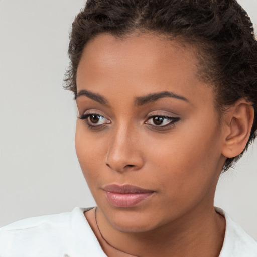 Neutral latino young-adult female with short  brown hair and brown eyes