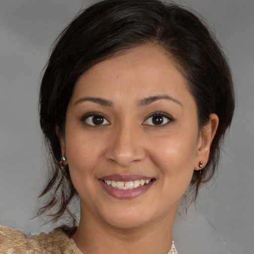 Joyful white young-adult female with medium  brown hair and brown eyes