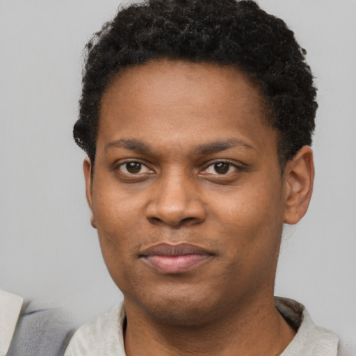 Neutral black young-adult male with short  brown hair and brown eyes