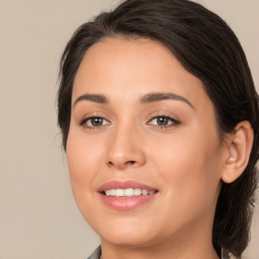 Joyful white young-adult female with medium  brown hair and brown eyes