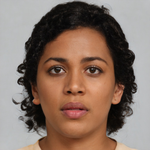 Neutral latino young-adult female with medium  brown hair and brown eyes