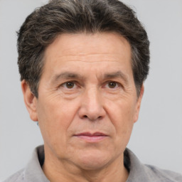 Joyful white middle-aged male with short  brown hair and brown eyes