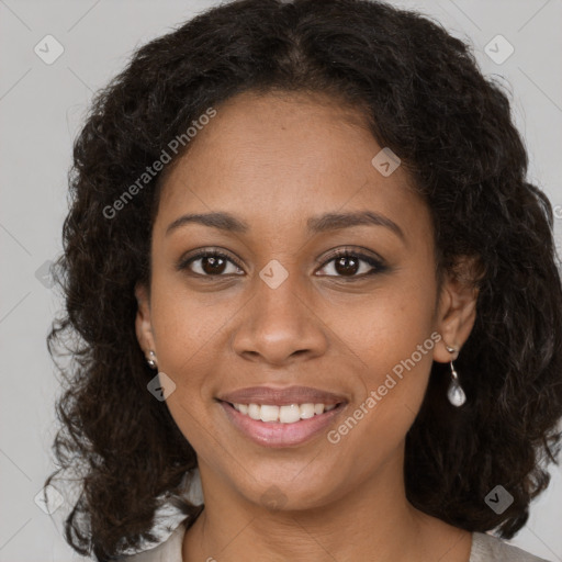 Joyful black young-adult female with medium  brown hair and brown eyes