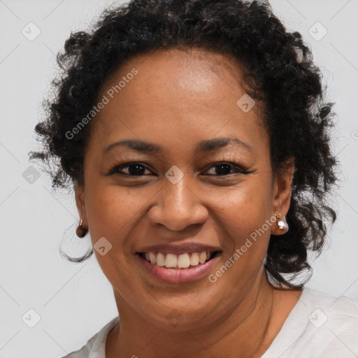 Joyful black adult female with short  brown hair and brown eyes