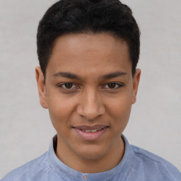 Joyful latino young-adult male with short  brown hair and brown eyes