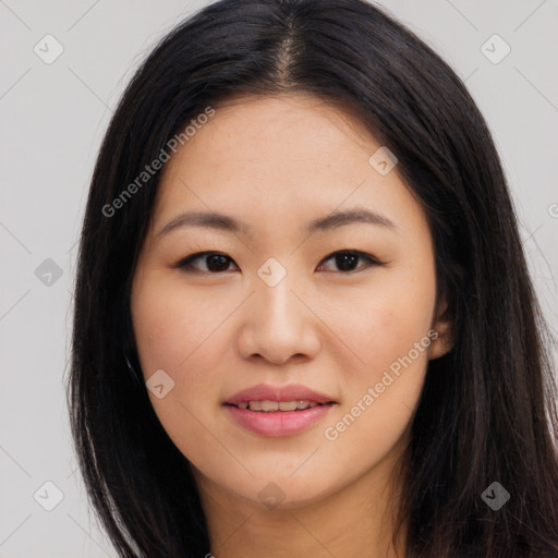 Joyful asian young-adult female with long  brown hair and brown eyes