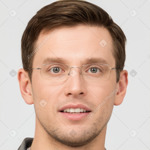 Joyful white young-adult male with short  brown hair and grey eyes