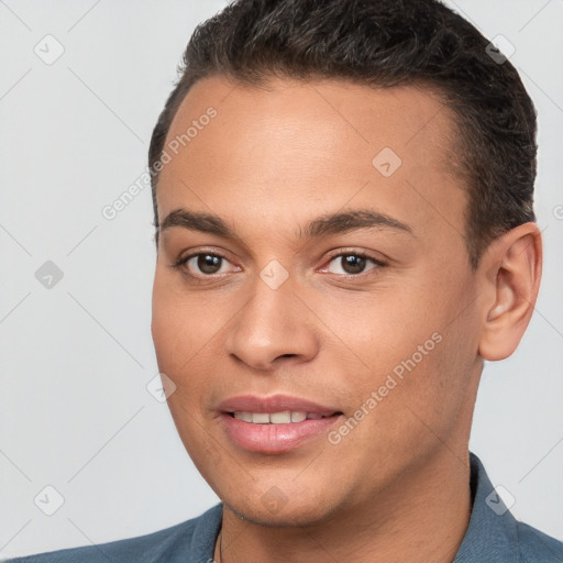 Joyful white young-adult male with short  brown hair and brown eyes