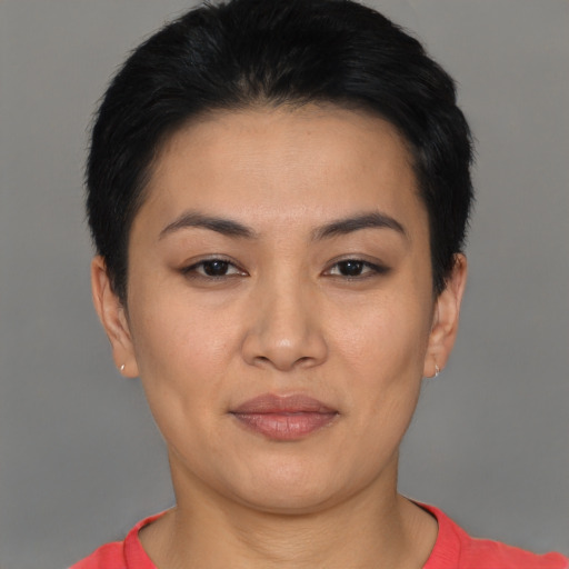 Joyful asian young-adult female with short  black hair and brown eyes