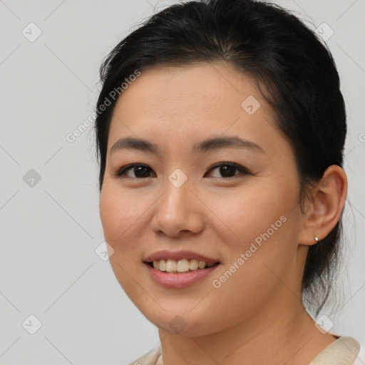 Joyful asian young-adult female with medium  brown hair and brown eyes