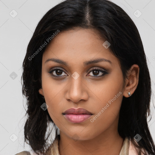 Joyful latino young-adult female with long  brown hair and brown eyes