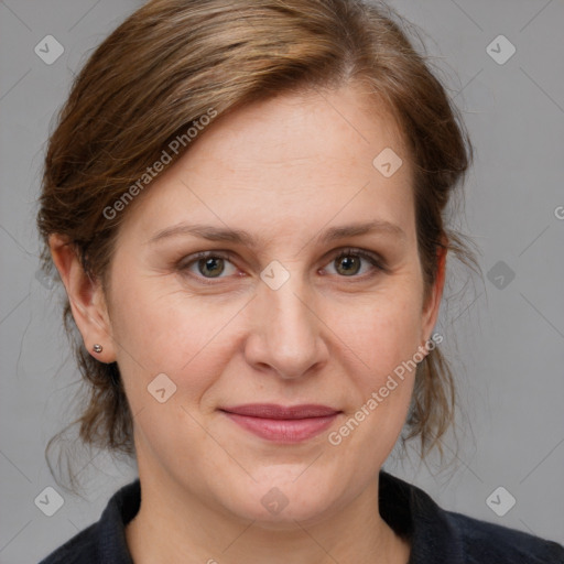 Joyful white adult female with medium  brown hair and grey eyes