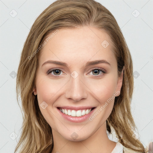 Joyful white young-adult female with long  brown hair and green eyes