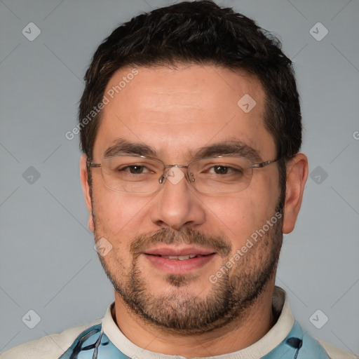 Joyful white adult male with short  black hair and brown eyes