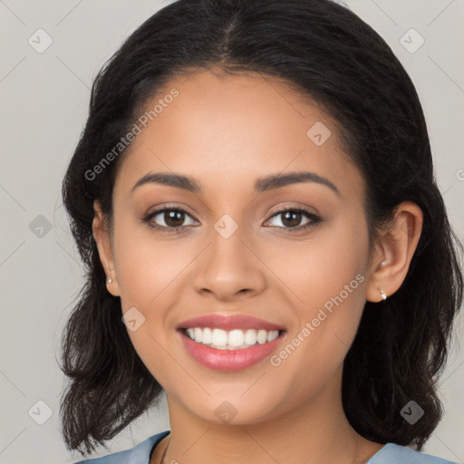 Joyful latino young-adult female with long  brown hair and brown eyes