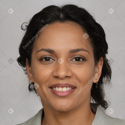 Joyful latino adult female with medium  brown hair and brown eyes