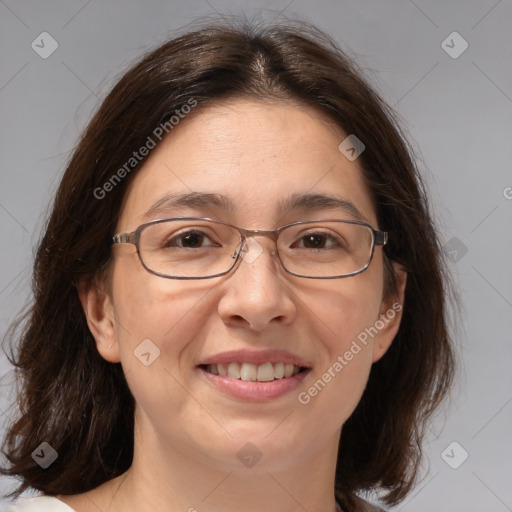 Joyful white adult female with medium  brown hair and brown eyes