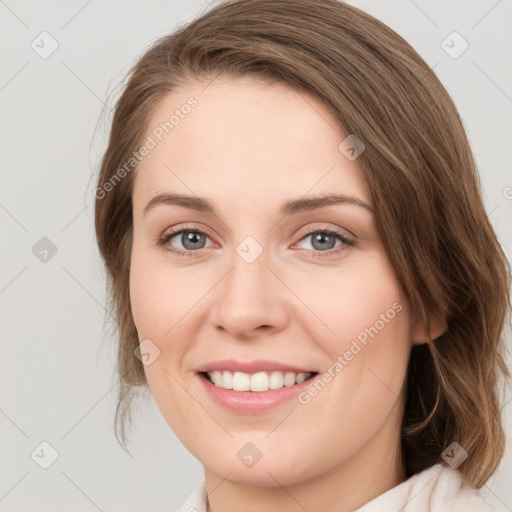 Joyful white young-adult female with medium  brown hair and green eyes