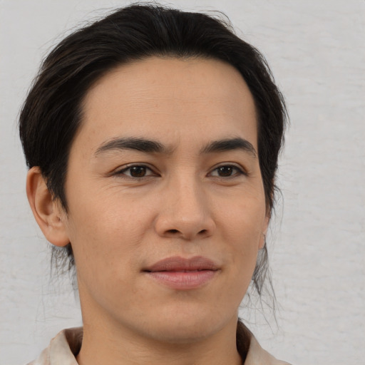 Joyful asian young-adult male with medium  brown hair and brown eyes