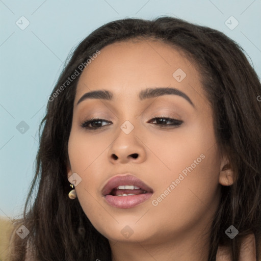 Joyful latino young-adult female with long  brown hair and brown eyes