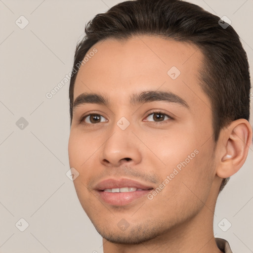 Joyful white young-adult male with short  brown hair and brown eyes