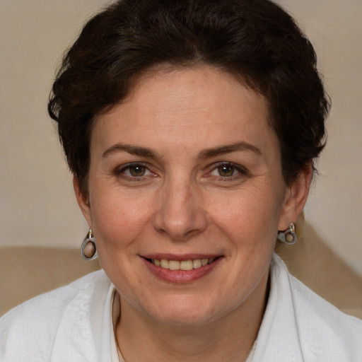 Joyful white adult female with short  brown hair and brown eyes