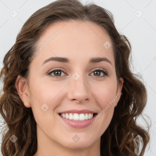 Joyful white young-adult female with long  brown hair and green eyes