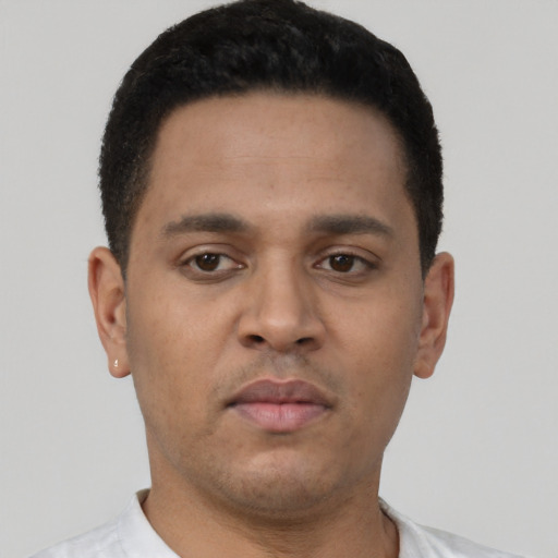 Neutral latino young-adult male with short  black hair and brown eyes