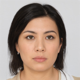 Neutral asian young-adult female with medium  brown hair and brown eyes