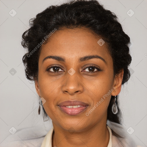 Joyful black young-adult female with medium  brown hair and brown eyes