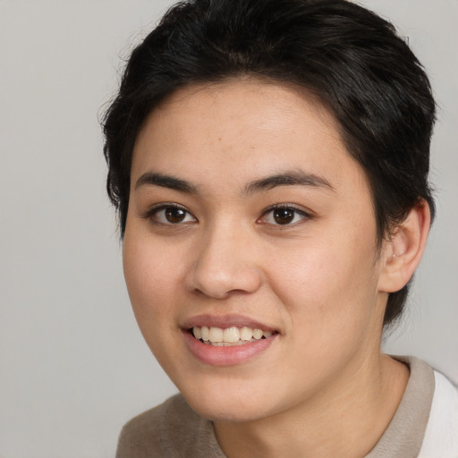 Joyful white young-adult female with short  brown hair and brown eyes