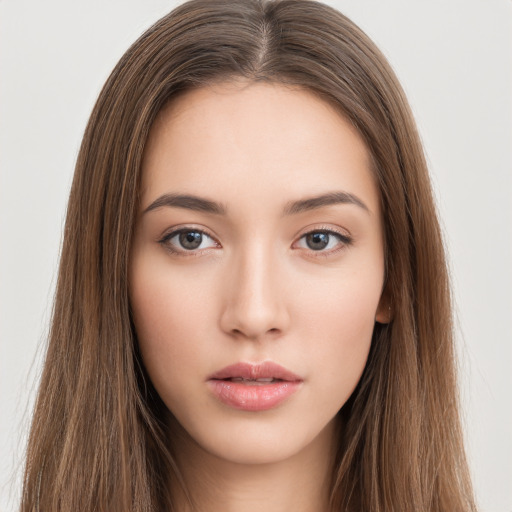 Neutral white young-adult female with long  brown hair and brown eyes