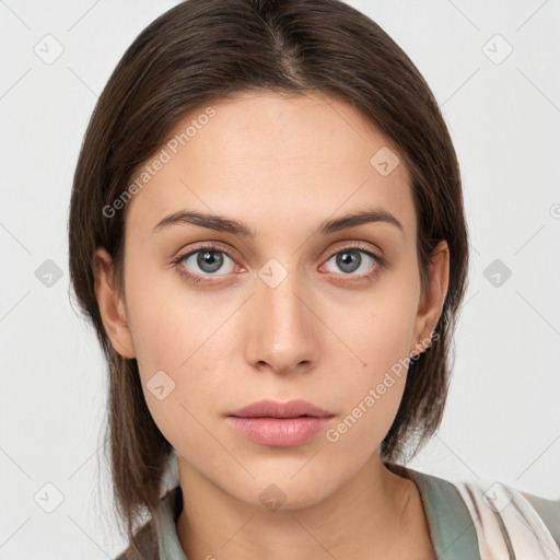 Neutral white young-adult female with medium  brown hair and grey eyes